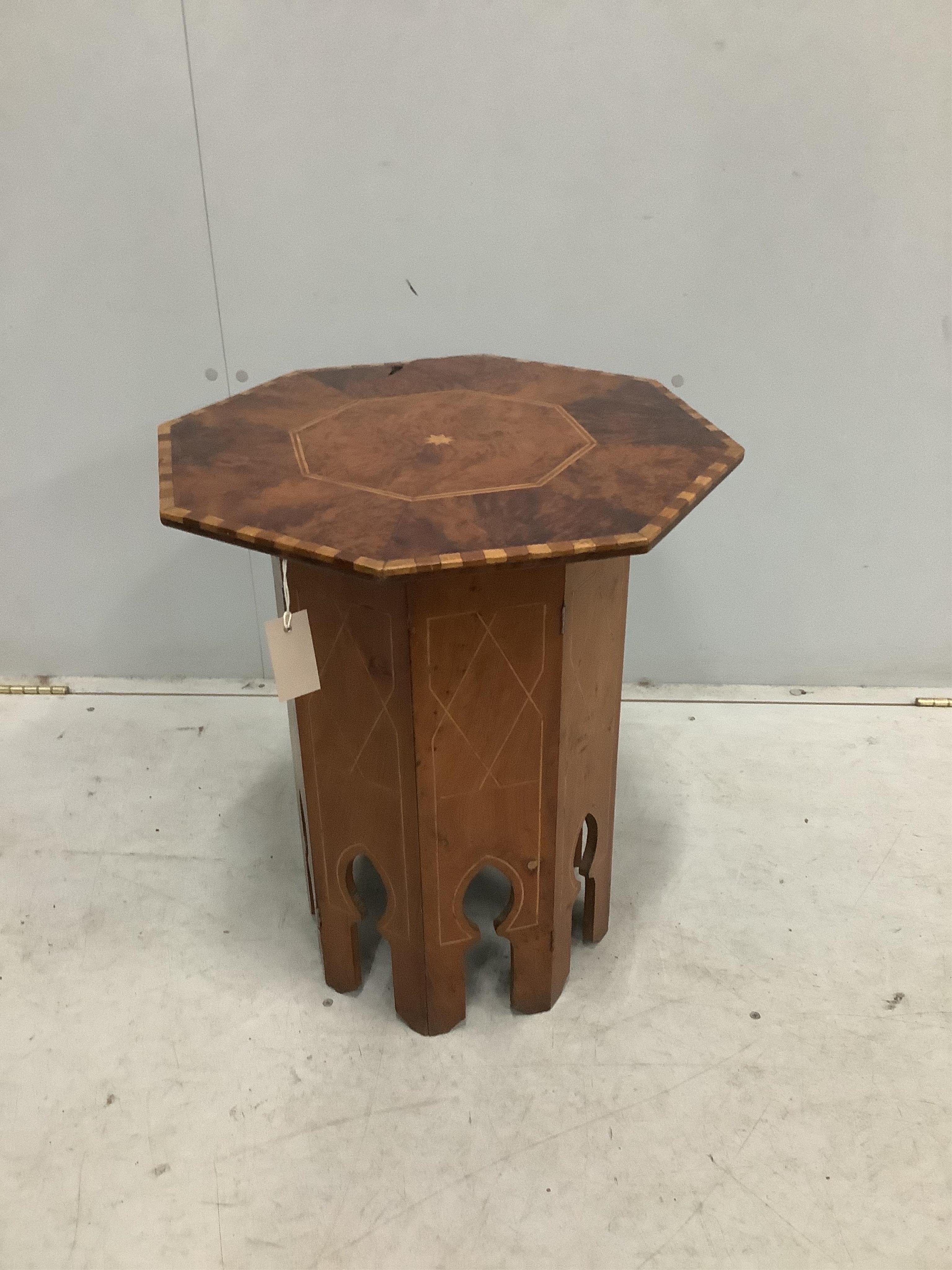 A Moorish style octagonal occasional table, width 48cm, height 57cm. Condition - poor to fair